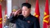 In this image made from video, North Korean leader Kim Jong Un salutes during the ceremony to mark the 70th anniversary of the country's ruling party in Pyongyang, Oct. 10, 2015. 
