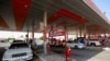 Drivers fill up their vehicles at a gas station in the holy Shi'ite city of Najaf, Iraq, Sept. 16, 2019. 