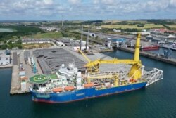 FILE - The Russian pipe-laying vessel Akademik Cherskiy, which may be used to complete the construction of the Nord Stream 2 gas pipeline, lies in the port of Mukran, Germany, July 7, 2020.