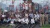 Demonstrators from the Samajwadi Party, a regional political party, shout slogans after they stopped a passenger train during a protest near Allahabad railway station, September 20, 2012. 