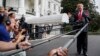 President Donald Trump speaks with reporters on the South Lawn of the White House, Oct. 8, 2018, in Washington. 