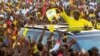 FILE - Uganda's president and presidential candidate Yoweri Museveni of the ruling party National Resistance Movement waves to his supporters as he arrives at a campaign rally in Entebbe, Uganda, Feb. 10, 2016.