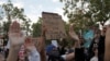 Demonstrators raise their arms during a protest against the death of African-American man George Floyd under Minneapolis police custody, in Oakland, California, U.S. May 29, 2020. REUTERS/Stephen Lam