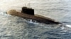 FILE - A Russian-built, Kilo-class diesel submarine purchased by Iran, is towed by a support vessel in this photograph taken in the central Mediterranean Sea during the week of Dec. 23, 1995. (DOD/AFP)
