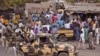 FILE - Nigerian soldiers patrol a market after recent violence in areas surrounding Maiduguri, Jan. 27, 2015.
