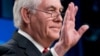 Secretary of State Rex Tillerson waves goodbye at the State Department in Washington, March 13, 2018, after his firing earlier in the day. President Donald Trump said he would nominate CIA Director Mike Pompeo as the top U.S. diplomat.