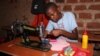 Girls at the Parents Care Infant Academy, including 14-year-old Catherine Nantume, are sewing a reusable sanitary towel in Makindye Kampala.
