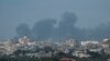 TOPSHOT - Smoke billows following Israeli bombardment north of Nuseirat in the central Gaza Strip on April 27, 2024, amid the ongoing conflict in the Palestinian territory between Israel and the militant group Hamas.