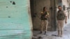 Syria Democratic Forces (SDF) fighters inspect a dead body of what they said was an Islamic State fighter inside a shop in Manbij, in Aleppo Governorate, Syria, August 7, 2016.