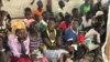 New refugee arrivals from South Sudan wait to register at the Imvempi reception center in Arua district, Uganda, Jan. 30, 2018. (H. Athumani/VOA)