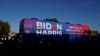 FILE - Then-Democratic presidential candidate former Vice President Joe Biden and then-Democratic vice presidential candidate Sen. Kamala Harris ride on a bus in Phoenix, Arizona, Oct. 8, 2020.