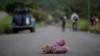 A doll of Central American migrant, part of a caravan trying to reach the U.S., is pictured along the highway to Arriaga from Pijijiapan, Mexico, Oct. 26, 2018.