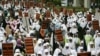 Indonesian members of Hizbut Tahrir, a conservative Islamic group in Jakarta, Indonesia, carry placards with signs reading, "Capitalism sucks the peoples blood" and "Uphold Sharia and Islamic government" in protest against capitalism. 