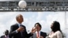 FILE - U.S. President Barack Obama bounces a soccer ball with his head at Ubungo Power Plant in Dar es Salaam, July 2, 2013. The ball, called a "soccket ball," has internal electronics that allow it to generate and store electricity that can power small devices.