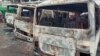 FILE - Burned buses are seen at the bus terminal in Buea, Cameroon, after gunfire broke out, July 9, 2018.