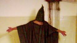 This image obtained by The Associated Press shows an unidentified detainee standing on a box with a bag on his head and wires attatched to him in late 2003 at the Abu Ghraib prison in Baghdad, Iraq.