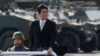 FILE - Japanese Prime Minister Shinzo Abe reviews Japanese Self-Defense Forces' (SDF) troops during the annual SDF ceremony at Asaka Base, Japan, Oct. 23, 2016.