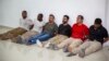 Sospechosos del asesinato del presidente de Haití, Jovenel Moïse son presentados ante los medios en la Dirección General de la policía en Puerto Príncipe, Haití, el 8 de julio de 2021. 