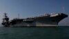 The aircraft carrier USS Carl Vinson is anchored in Hong Kong water, Dec. 27, 2011. The carrier currently is headed towards the Korean Peninsula as a “prudent measure.”
