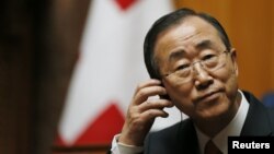 UN Secretary-General Ban Ki-moon listens to a speech in the Swiss National Council during his visit in the Autumn Parliament Session in Bern, September 11, 2012.