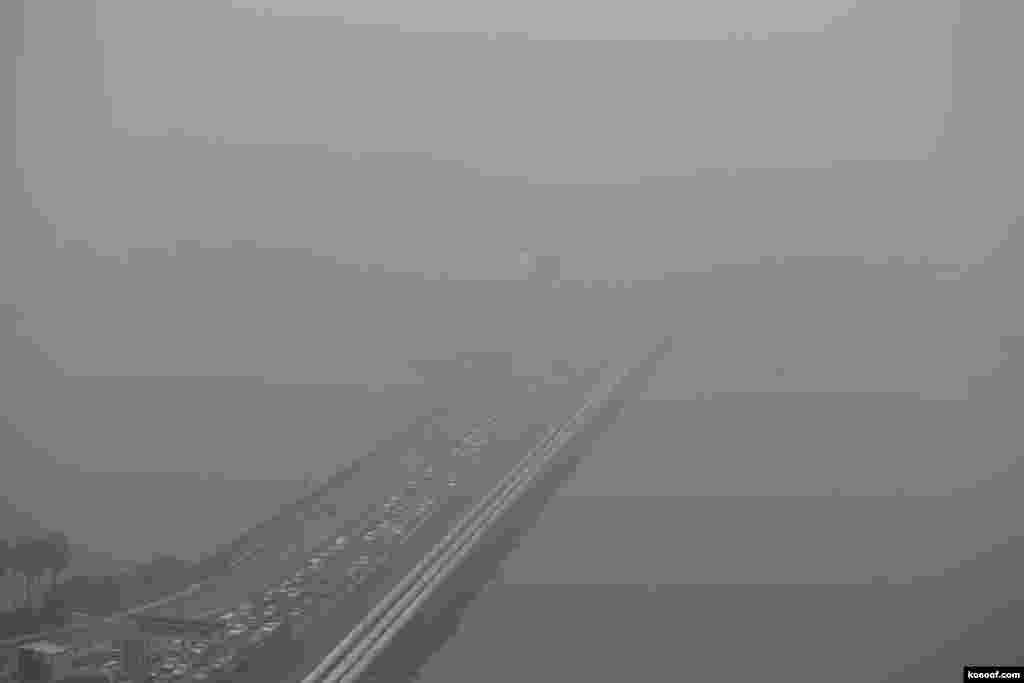 A view of the vehicles plying the causeway to Malaysia shrouded by haze in Singapore. Slash-and-burn agriculture in neighboring Indonesia has blanketed Singapore in a choking haze for weeks.