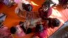 FILE - Rohingya refugee children play inside a makeshift school at Kutupalong Refugee Camp near Cox's Bazar, Bangladesh, Jan. 21, 2018.