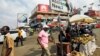 People walk on the street around Kwame Nkrumah circle in Accra, Ghana, Dec. 2, 2016. 