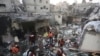Palestinians look for survivors of the Israeli bombardment of the Gaza Strip in Rafah on Dec. 12, 2023.