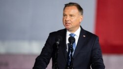 FILE - Polish President Andrzej Duda speaks to a crowd during an event in Gdansk-Westerplatte, Sept. 1, 2020.