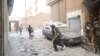 Forces loyal to President Bashar al-Assad are seen at Suleiman al-Halabi neighbourhood in Aleppo city, Syria, September 20, 2012. 