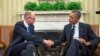 President Barack Obama, right, and Ukraine Prime Minister Arseniy Yatsenyuk, left, shake hands in the Oval Office of the White House in Washington, March 12, 2014.