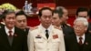 Vietnam's Public Security Minister General Tran Dai Quang (C) stands with Communist Party's General Secretary Nguyen Phu Trong (R) and Politburo member Dinh The Huynh (L) at a closing ceremony in Hanoi, January 28, 2016. 