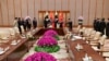 FILE - Pakistani Prime Minister Imran Khan, back second from left, speaks with Chinese Premier Li Keqiang, back third from left, during a signing ceremony at the Diaoyutai State Guesthouse in Beijing, April 28, 2019. 