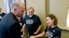 David Coombs, defense attorney for Army Pfc. Bradley Manning, shakes hands with supporters at a news conference in Hanover, Md.,after Manning was sentenced to 35 years in prison for leaking classified information to WikiLeaks, Aug. 21, 2013. 