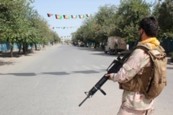 Afghan security forces stand guard during a fight against Taliban fighters in Kunduz province north of Kabul, Afghanistan, Aug. 31, 2019. The Taliban launched a large-scale attack on one of Afghanistan's main cities, Kunduz.