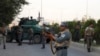 Afghan security personnel secure the site of an attack in Kabul, Afghanistan, July 28, 2019. 