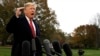 FILE - President Donald Trump talks to the media before boarding Marine One on the South Lawn of the White House, Nov. 9, 2018, in Washington.