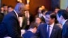 U.S. Secretary of Defense Lloyd Austin greets Philippine President Ferdinand Marcos Jr., center, and Singapore Prime Minister Lawrence Wong, right, at the Shangri-La Dialogue summit in Singapore on May 31, 2024. 