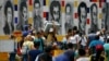 Venezuelans return to their country through the San Antonio del Tachira, Venezuela crossing, after shopping in Cucuta, Colombia, Friday, Feb. 8, 2019. 