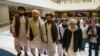 FILE In this file photo taken on Tuesday, May 28, 2019, Mullah Abdul Ghani Baradar, the Taliban group's top political leader, third from left, arrives with other members of the Taliban delegation for talks in Moscow, Russia. 
