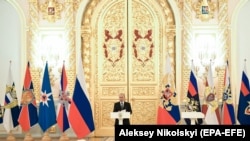 Russian President Vladimir Putin speaks during a ceremony to present military officers and prosecutors appointed to senior command posts and promoted to higher military titles and ranks at the Alexander Hall in the Grand Kremlin Palace in Moscow, Russia, April 11, 2019. EPA-E