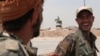 Kurdish fighters from the People's Protection Units (YPG) chat in the Ghwairan neighborhood of Hasaka, Syria, Aug. 22, 2016. U.S. and Russian efforts to protect the local population have allowed civilians to start returning to the city.