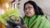 In this file photo taken on March 6, 2003, Indian author Sushmita Banerjee holds one of her novels.