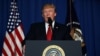 FILE - U.S. President Donald Trump delivers a statement about missile strikes on a Syrian airbase, at his Mar-a-Lago estate in West Palm Beach, Florida.