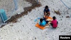 An undated image supplied by Amnesty International claims to show children playing near at the Australian-run detention center on the Pacific island nation of Nauru. 