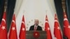 FILE - Turkey's Recep Tayyip Erdogan speaks at the Presidential palace in Ankara, Turkey, Sept. 10, 2019. 