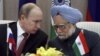 Russian President Vladimir Putin, left, talks with Indian Prime Minister Manmohan Singh at a press conference after signing weapons deals worth billions in New Delhi, India, Monday, Dec. 24, 2012. 