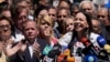 ARCHIVO - María Corina Machado, candidata presidencial opositora en Venezuela, pronuncia un discurso en Caracas el pasado 29 de enero. Entre los dirigentes políticos que le acompañan, están Juan Pablo Guanipa y César Pérez Vivas, a la izquierda.