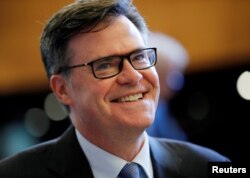 FILE - Dennis Shea, U.S. Ambassador to the WTO, arrives for the General Council meeting at the World Trade Organization in Geneva, Switzerland, July 26, 2018.