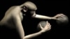 Large-scale brain activity from a rhesus monkey was decoded and used to simultaneously control reaching movements of both arms of a virtual monkey avatar towards spherical objects in virtual reality. Photo: Duke Center for Neuroengineering